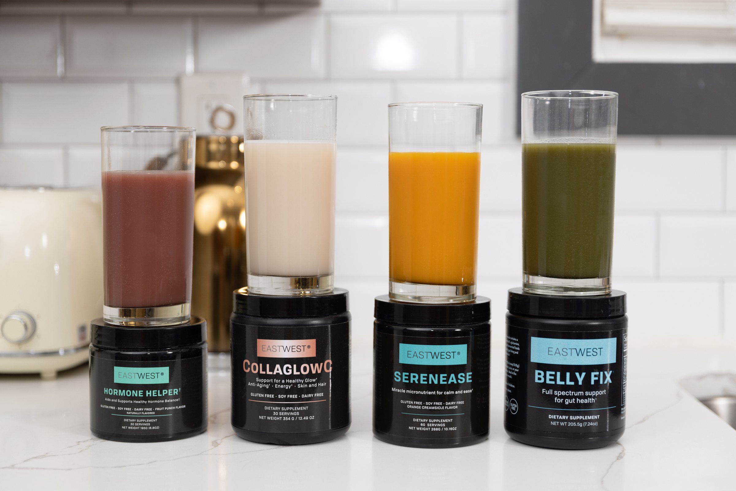 EastWest Hormone Helper, Collaglow, Serenease and Belly Fix powders with mixed drinks